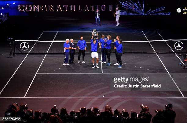 Roger Federer poses with trophy with team mates Marin Cilic, Bjorn Borg, Rafael Nadal, Rod Laver, Alexander Zverev, Tomas Berdych and Dominic Thiem...