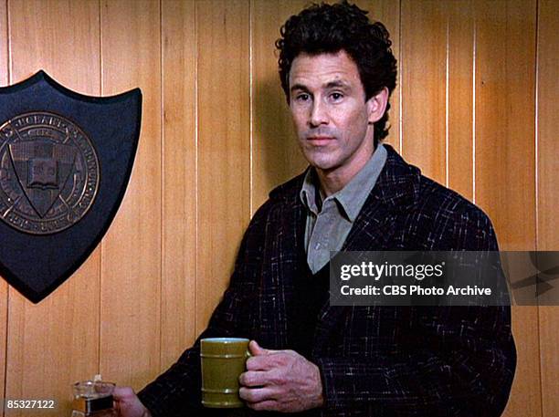 Canadian actor Michael Ontkean pours a cup of coffee in a scene screen grab from the pilot episode of the television series 'Twin Peaks,' originally...
