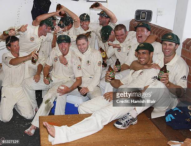 The Australian team celebrate winning their second Test and taking an unbeatable 2 - 0 series lead during day five of the Second Test between South...