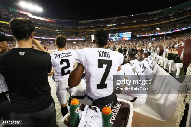 Punter Marquette King of the Oakland Raiders sits during the national anthem before they take on the Washington Redskins at FedExField on September...