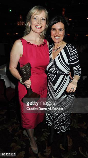 Carol Kirkwood poses with the TV Weather Presenter Award alongside Susanna Reid during the TRIC Awards 2009, at the Grosvenor House Hotel on March...