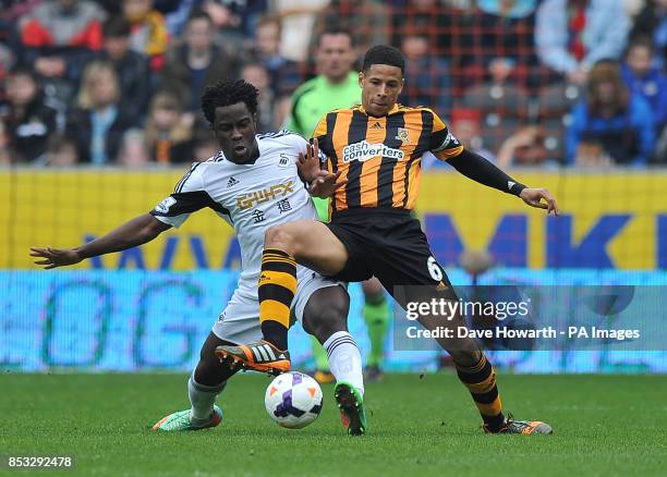 Hull City's Curtis Davies and Swansea City's Wilfried Bony battle for the ball during the Barclays Premier League match at the KC Stadium, Hull.