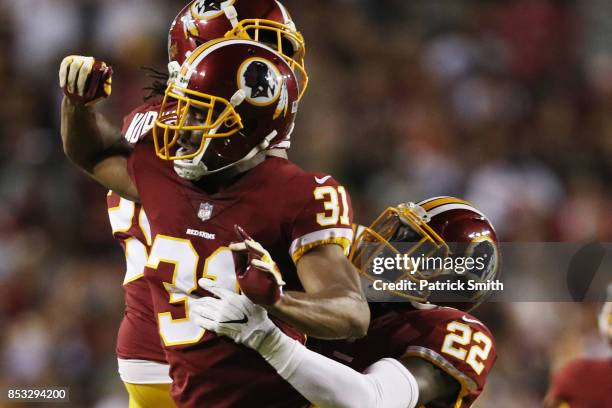 Running back Samaje Perine of the Washington Redskins celebrates strong safety Deshazor Everett of the Washington Redskins in the second quarter of...