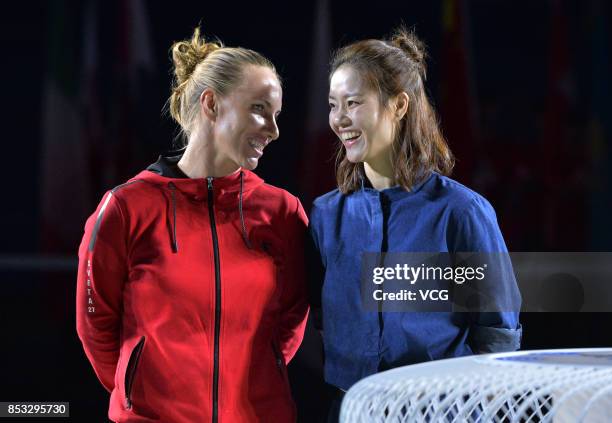 Tennis player Svetlana Kuznetsova and former tennis player Li Na attend the opening ceremony of 2017 WTA Wuhan Open at Optics Valley International...