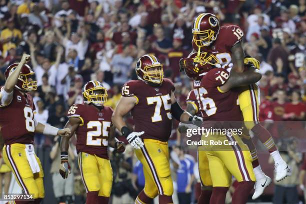 Wide receiver Josh Doctson of the Washington Redskins celebrates his touchdown with offensive tackle Morgan Moses of the Washington Redskins against...