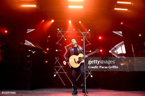 Singer Luis Fonsi performs in concert during Love + Dance World Tour at Coca Cola Roxy on September 24, 2017 in Atlanta, Georgia.