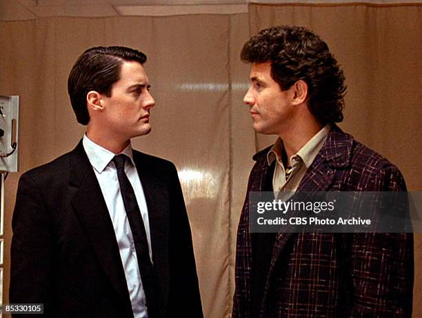 American actor Kyle MacLachlan and Canadian actor Michael Ontkean stare at one another in a scene screen grab from the pilot episode of the...