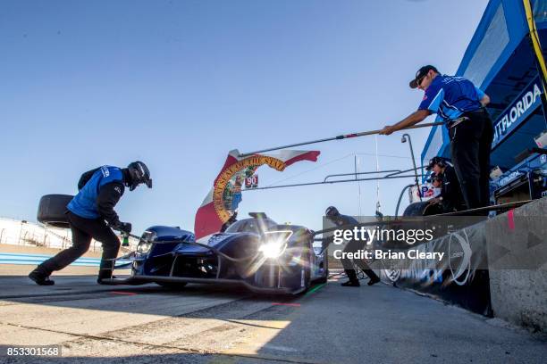 The Ligier LMP2 of Renger van der Zande, of the Netherlands, and Marc Goosens, of Belgium, practices pit stops before the IMSA WeatherTech Sportscar...