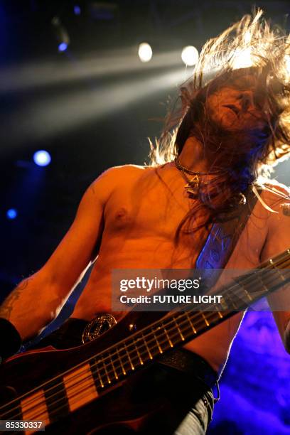 Ted Lundstrom of Amon Amarth performs on stage at the HMV Forum.