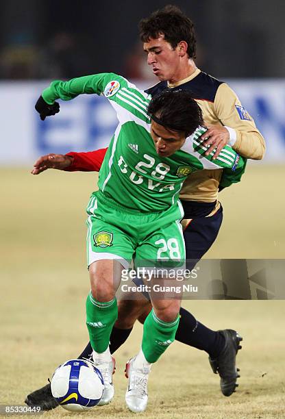 Benjamin Kantarovski of Newcastle Jets and Guo Hui of Beijing Guoan fight for a ball during the AFC Champions League Group E match between Beijing...