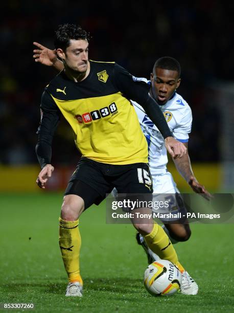 Watford's Albert Riera holds off a challenge from Leeds United's Dominic Poleon during the Sky Bet Championship match at Vicarage Road, London.