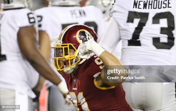 Outside linebacker Ryan Kerrigan of the Washington Redskins celebrates his sack against the Oakland Raiders in the third quarter at FedExField on...