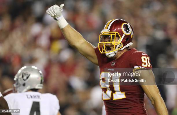 Outside linebacker Ryan Kerrigan of the Washington Redskins celebrates his sack against the Oakland Raiders in the third quarter at FedExField on...