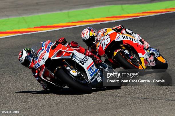 Spanish riders, Jorge Lorenzo of Ducati Team and Daniel Pedrosa of Repsol Honda Team, fighting for the 2nd place during the Gran Premio Movistar de...