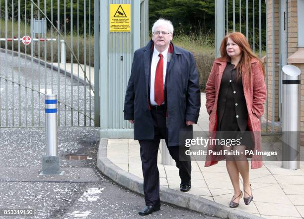 Michael Gallagher,who lost his son Aidan in the Omagh bomb attack, with his daughter Kat, outside Dungannon courthouse.