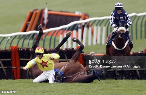 Sam Twiston-Davies riding Fascino Rustico falls during the Alan Shearer's Speedflex Handicap Hurdle Race during day one of the Coral Scottish Grand...