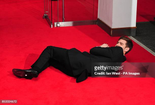 Andrew Garfield larking around on the red carpet at the world premiere of the film The Amazing Spiderman 2, held at the Odeon Leicester Square,...