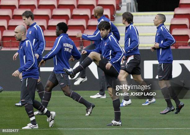 Olympique Lyonnais player Pernambucano Juninho streches during a training session at the Camp Nou stadium in Barcelona, on March 10, 2009 on the eve...