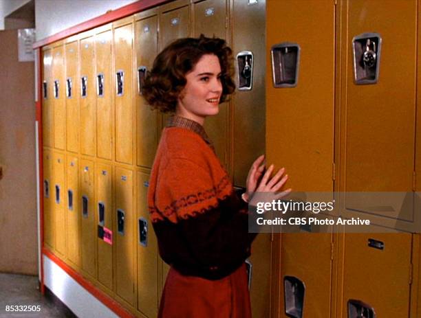 American actress Lara Flynn Boyle stands at a locker in school hallway set in a scene screen grab from the pilot episode of the television series...