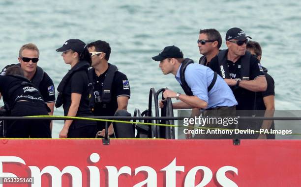 The Duke of Cambridge steers a yacht as the Duke and Duchess of Cambridge race against each other on two Emirates Team New Zealand Americas Cup...