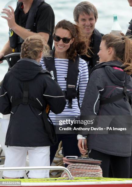 The Duchess of Cambridge speaks with crew as the Duke and Duchess of Cambridge race against each other on two Emirates Team New Zealand Americas Cup...
