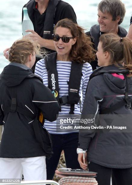 The Duchess of Cambridge speaks with crew as the Duke and Duchess of Cambridge race against each other on two Emirates Team New Zealand Americas Cup...