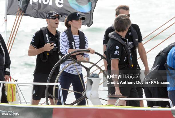 The Duchess of Cambridge steers a yacht as the Duke and Duchess of Cambridge race against each other on two Emirates Team New Zealand Americas Cup...