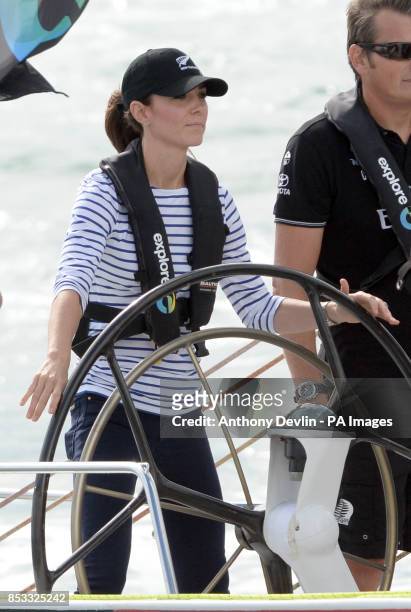The Duchess of Cambridge steers a yacht as the Duke and Duchess of Cambridge race against each other on two Emirates Team New Zealand Americas Cup...