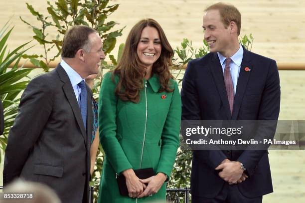 New Zealand's Prime Minister John Key looks-on as the Duke and Duchess of Cambridge share a laugh as they open the velodrome during a visit to the...