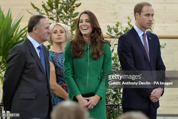 New Zealand's Prime Minister John Key looks-on as the Duke and Duchess of Cambridge share a laugh as they open the velodrome during a visit to the...