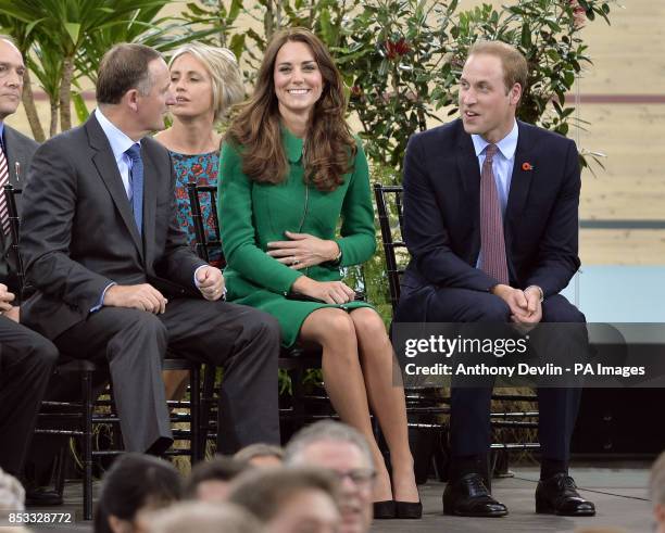 New Zealand's Prime Minister John Key looks-on as the Duke and Duchess of Cambridge share a laugh as they open the velodrome during a visit to the...