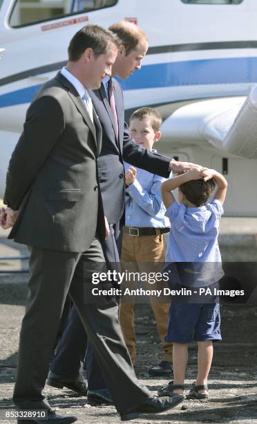 The Duke of Cambridge greets a young boy during a visit to Pacific Aerospace at Hamilton Airport during the sixth day of the Duke and Duchess of...