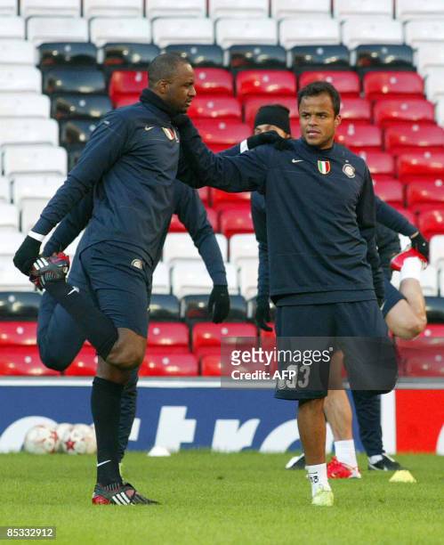 Inter Milan's French midfielder Patrick Vieira and Amantino Mancini stretch during a training session at Old Trafford on the eve of a Champions...