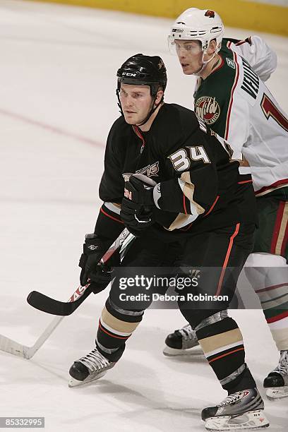 Stephane Veilleux of the Minnesota Wild defends against James Wisniewski of the Anaheim Ducks during the game on March 8, 2009 at Honda Center in...