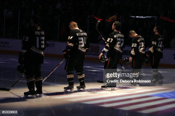 The Anaheim Ducks stand on the ice during the singing of the national anthem prior to the game against the during the Minnesota Wild on March 8, 2009...