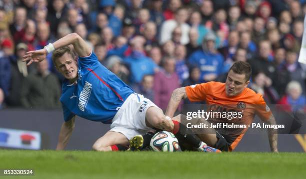 Rangers' Dean Shiels and Dundee United's Paul Paton battle for the ball during the William Hill Scottish Cup Semi Final match at Ibrox, Glasgow.