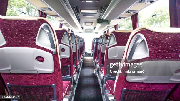 interior of empty bus - airport bus stock-fotos und bilder