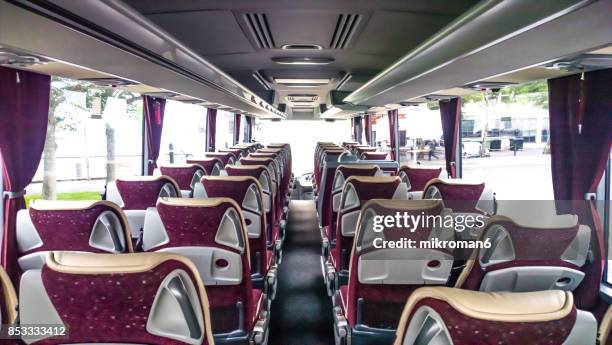 interior of empty bus - upholstered furniture stock pictures, royalty-free photos & images