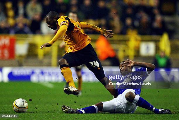 Kyel Reid of Wolverhampton beats the tackle from Kevin Lisbie of Ipswich during the Coca-Cola Championship match between Woverhampton Wanderers and...