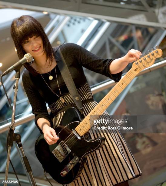 Photo of BLOOD RED SHOES and Laura Mary CARTER; Laura Mary Carter performing in a Zavvi record store