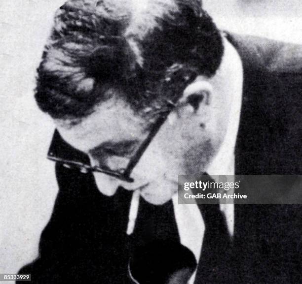 Photo of Bernard HERMANN; posed, smoking cigarette