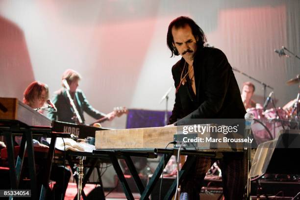 Photo of Nick CAVE and Nick CAVE & THE BAD SEEDS, Nick Cave performing on stage, keyboards