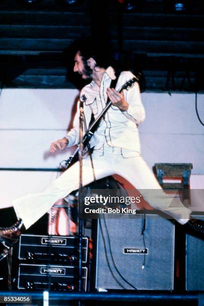 Photo of The Who and Pete TOWNSHEND; Pete Townshend performing on stage, jumping