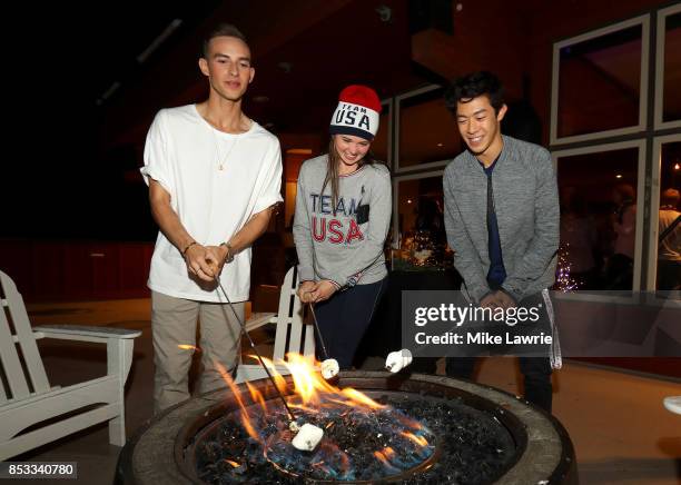 Figure skaters Adam Rippon, Mariah Bell and Nathan Chen make smores during the Team USA Media Summit opening reception at the Red Pine Lodge on...