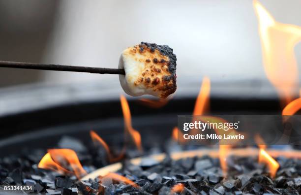Guests make smores during the Team USA Media Summit opening reception at the Red Pine Lodge on September 24, 2017 in Park City, Utah.