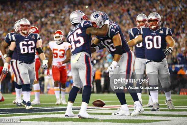 Mike Gillislee of the New England Patriots reacts after scoring a touchdown during the first quarter against the Kansas City Chiefs at Gillette...