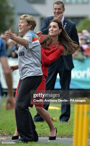 The Duchess of Cambridge reacts as the Duke of Cambridge hits a shot towards her during in a 2015 Cricket World Cup event in Christchurch during the...