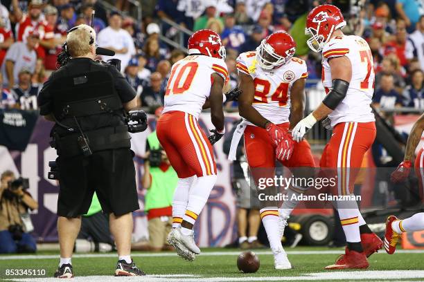 Demetrius Harris of the Kansas City Chiefs celebrates with teammates after scoring a touchdown during the first quarter against the New England...