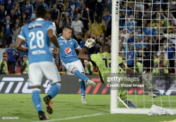 Ayron del Valle of Millonarios shots to score the first goal of his team during a match between Millonarios and Deportivo Pasto as part of Liga...