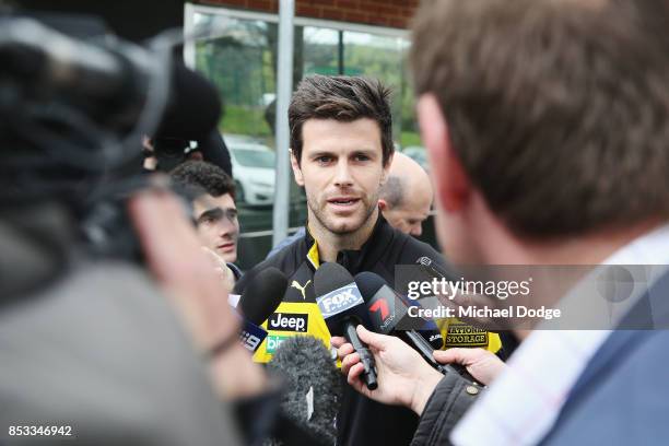 Trent Cotchin of the Tigers speaks to the media after he was cleared of any penalty for his bump on Dylan Shiel of the Giants on the weekend during a...